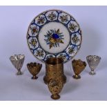 AN IZNIK TYPE POTTERY DISH, together with mixed Turkish metal ware. (7)