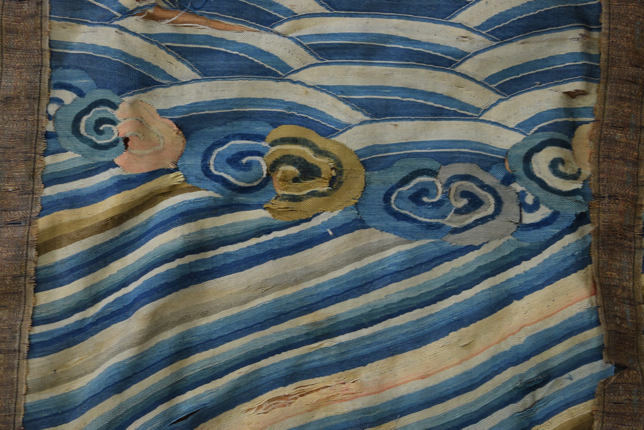 A 19TH CENTURY CHINESE BLUE GROUND EMBROIDERED SILK PANEL, together with a Thangka and two other - Image 6 of 6