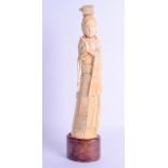 AN 18TH CENTURY CHINESE CARVED IVORY FIGURE OF AN IMMORTAL possibly Yongzheng, modelled as a