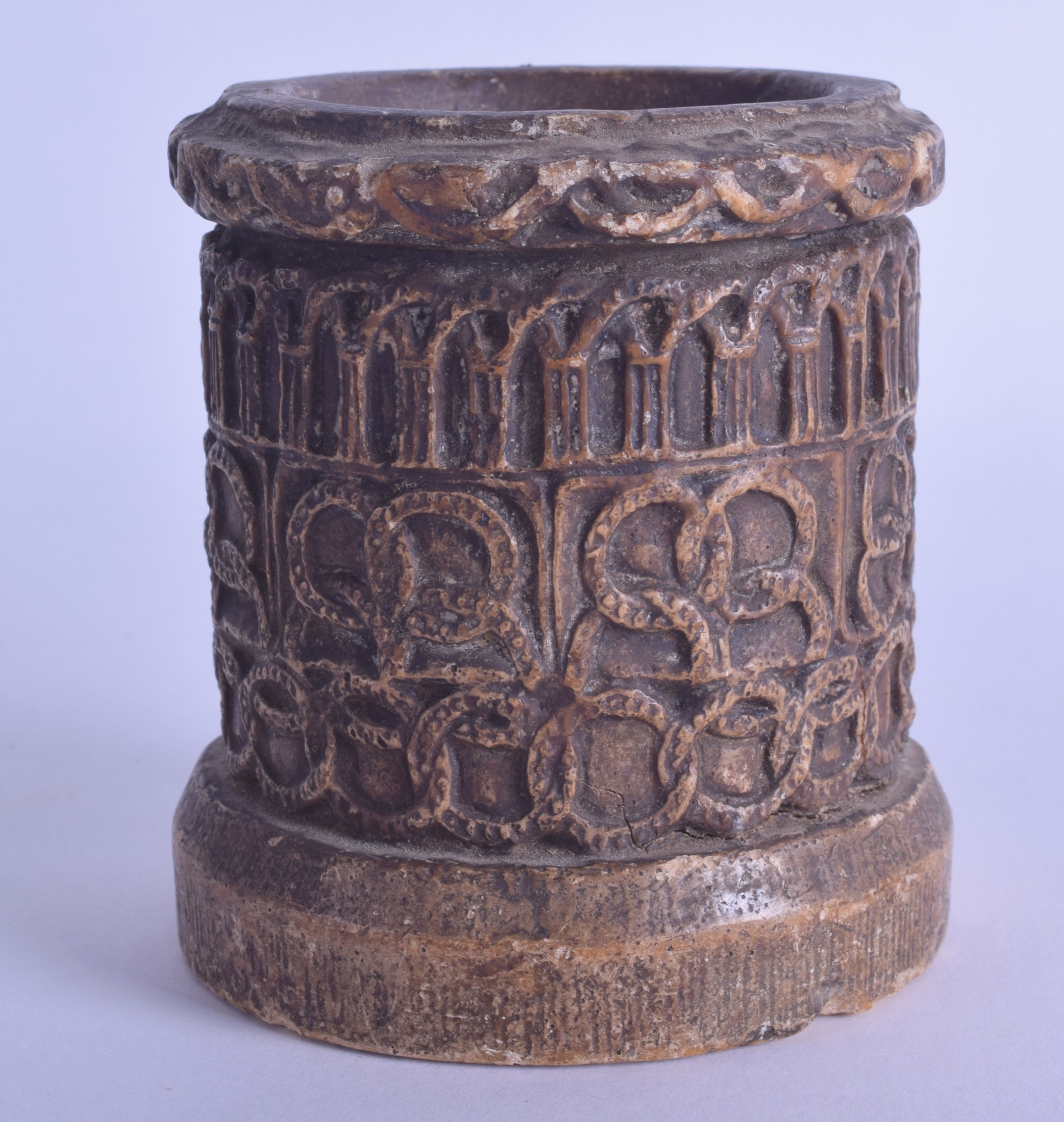 AN 18TH CENTURY CONTINENTAL WAX MORTAR decorated with Celtic motifs and vines. 9.5 cm x 8 cm.