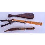 A VINTAGE TRAP CLAY PIGEON SKEET THROWER, together with a dagger and wooden opium scales. (3)