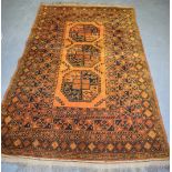 A BROWN GROUND PERSIAN RUG, decorated with geometric motifs. 204 cm x 126 cm.