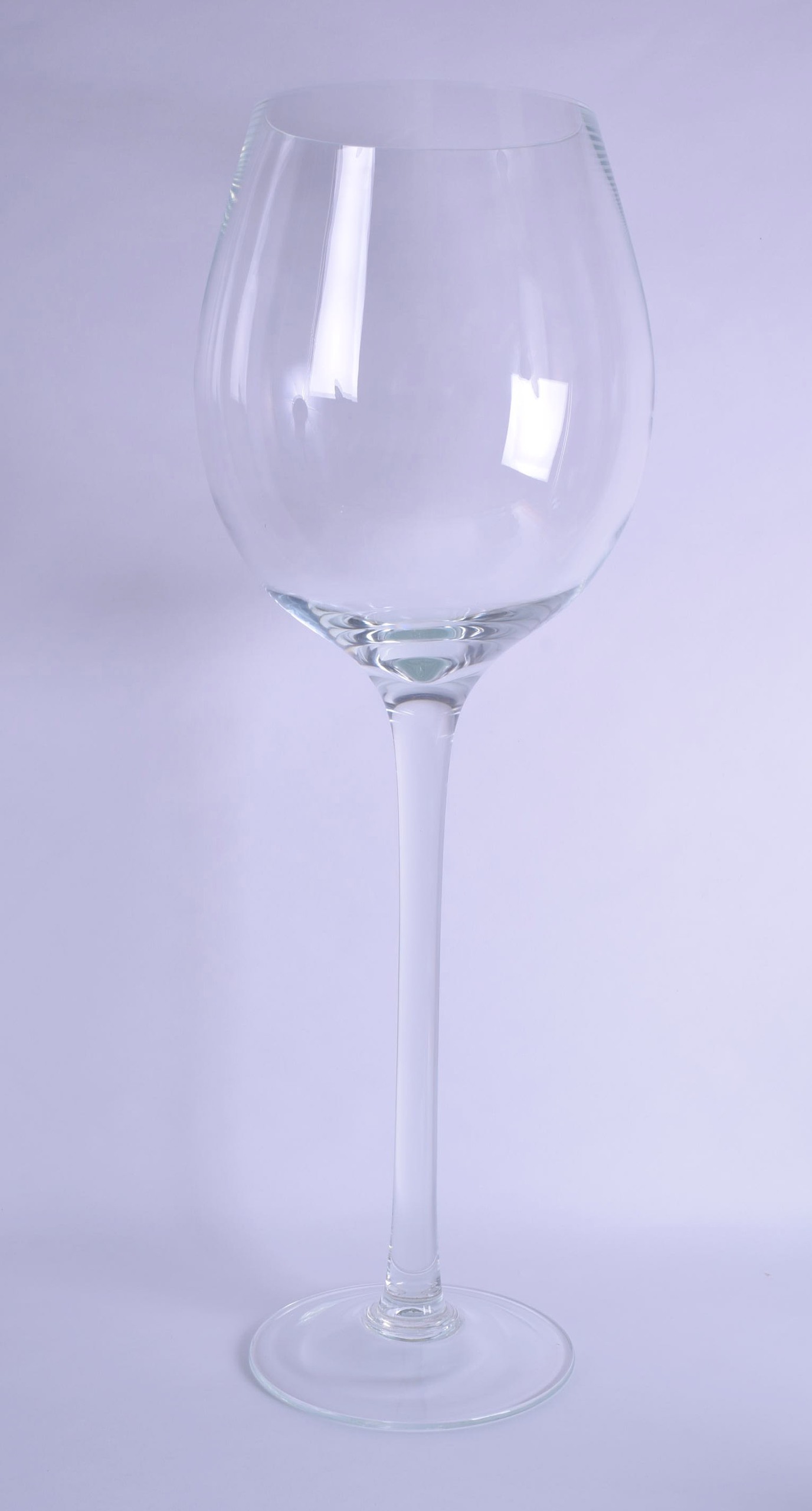 AN UNUSUAL GINORMOUS CRYSTAL NOVELTY WINE GLASS. 80 cm x 28 cm.