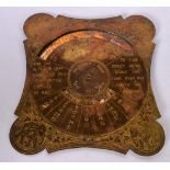 AN INDIAN BRASS CALENDAR, by C.L Khannah & Son, Moradabad. 18 cm wide.