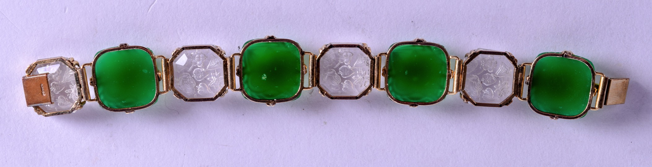 A STYLISH 1920S CRYSTAL GREEN GLASS DECO BRACELET engraved with foliage and stylised motifs. 19 cm - Image 2 of 3