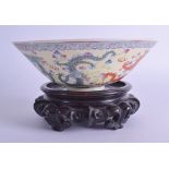 A GOOD 19TH CENTURY CHINESE FAMILLE ROSE CONICIAL DRAGON BOWL Guangxu, bearing Jiaqing marks to