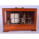 AN ANTIQUE CASED BAROGRAPH, by F Darton & Co, Watford England, the base fitted with a single drawer.