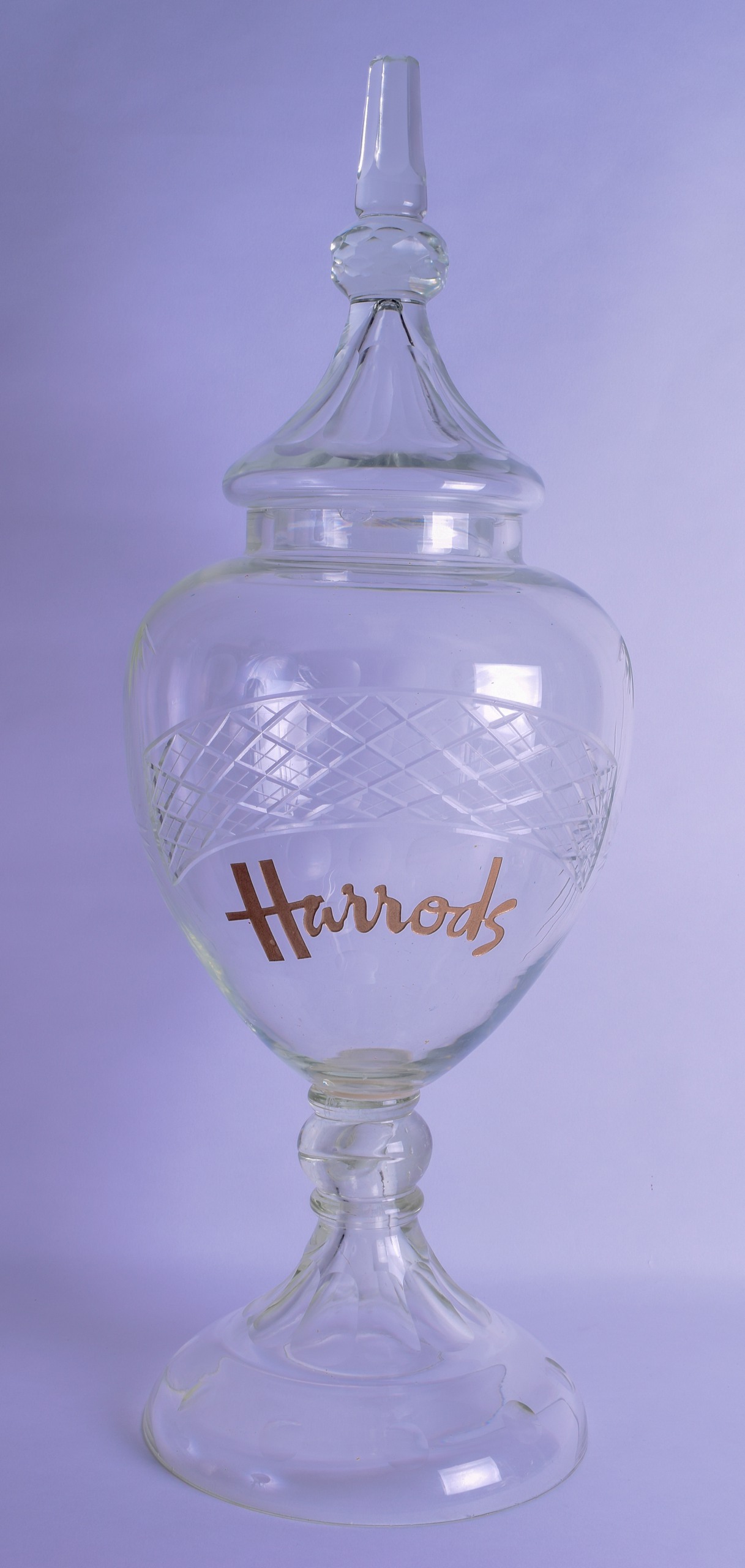 A VERY LARGE VINTAGE HARRODS GLASS BALUSTER JAR AND COVER. 78 cm x 24 cm.