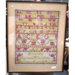 A FRAMED ANTIQUE SAMPLER, circa 1873. 41 cm x 31 cm.