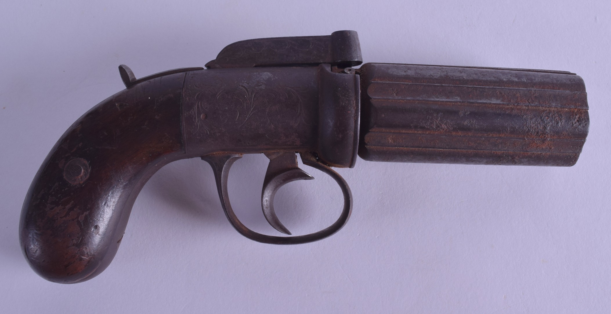 AN EARLY 19TH CENTURY PEPPER POT REVOLVER SIX BARREL PISTOL with engraved floral decoration. 18.5 cm