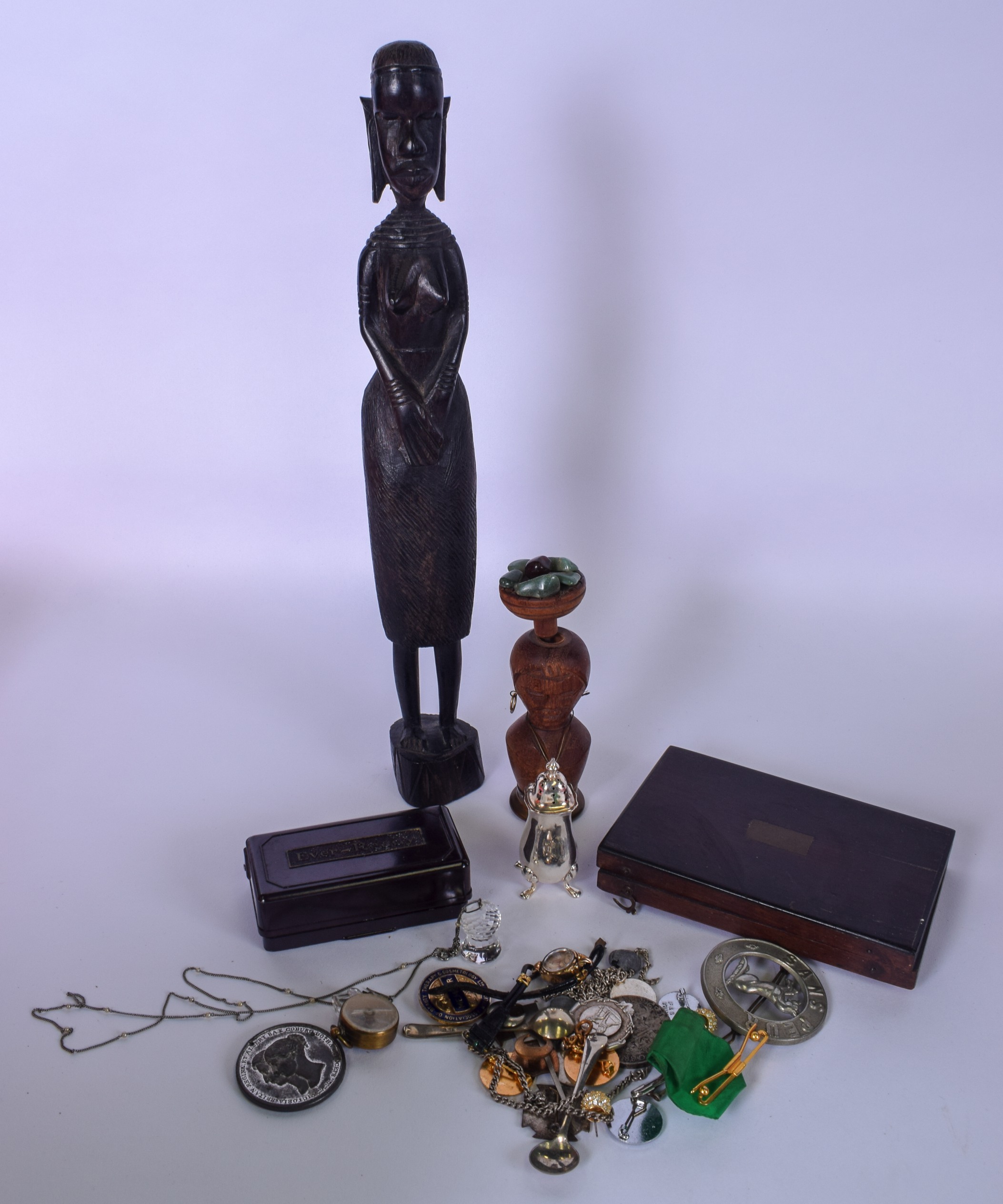 AN AFRICAN HARDWOOD FIGURE, together with a quantity of badges, part drawing set etc.