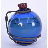 A RARE VICTORIAN BLUE GLASS FIREMAN'S HAND GRENADE, with metal supports and wax seal. 11 cm high.