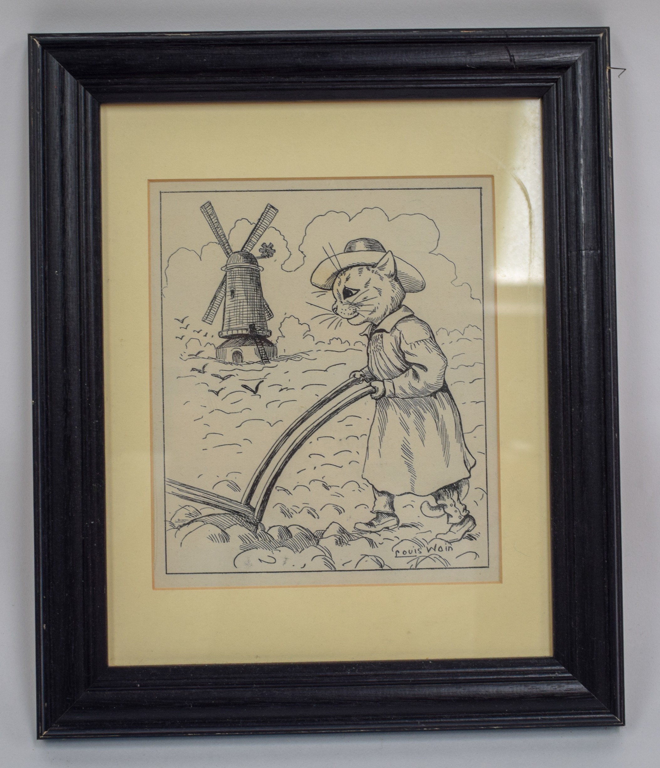 AFTER LOUIS WAIN (1860-1939), framed print, depicting an amusing image of a cat ploughing a field.