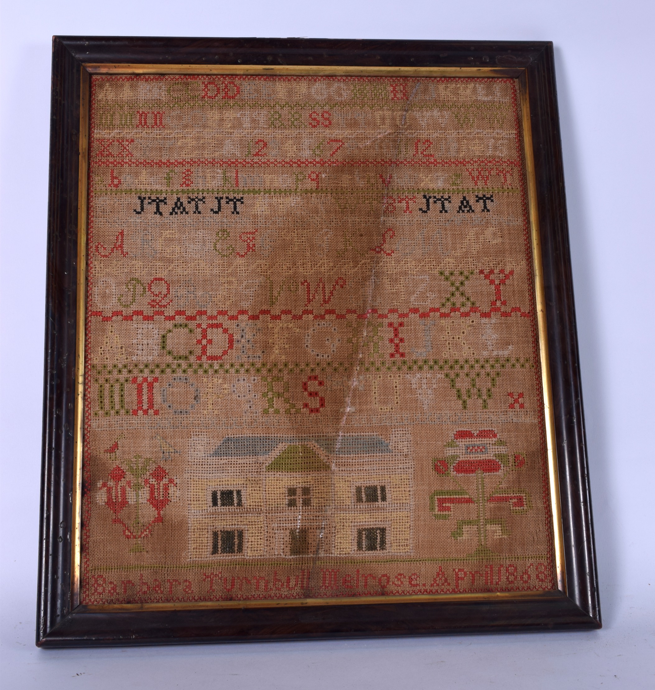 A 19TH CENTURY SAMPLER, "Barbara Turnball Melrose, April 1868". 47 cm x 36 cm.