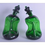 A PAIR OF DANISH HOLMEGAARD GLUK GLUK decanters of unusual curving form. 23 cm high.