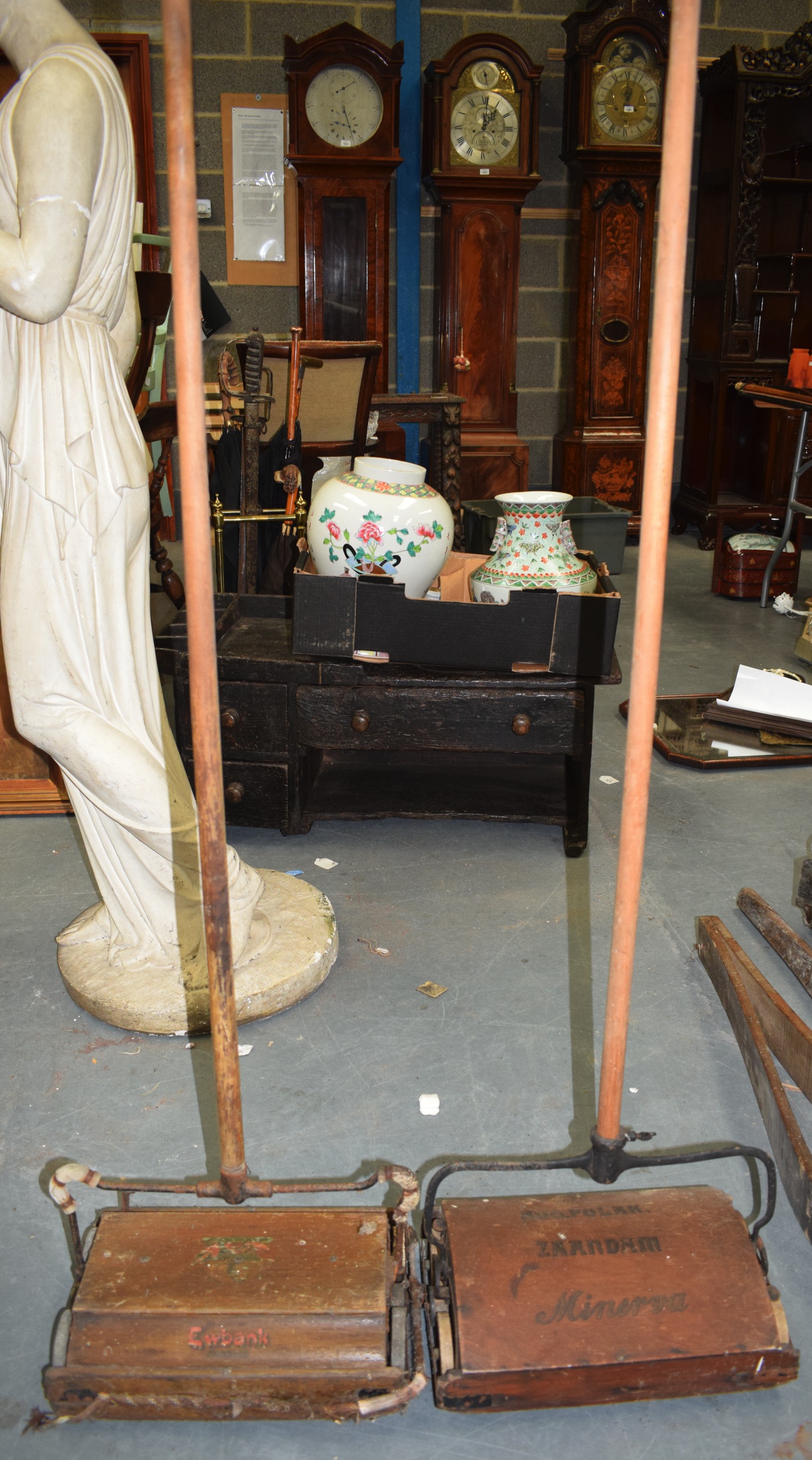 A VINTAGE EWBANK HOOVER, together with a Zaandam Minerva hoover. 142 cm high.