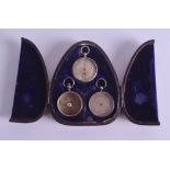 A RARE VICTORIAN CASED SET OF THREE MINIATURE FOBS including a barometer, thermometer & compass. (