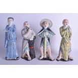 A SET OF FOUR EARLY 20TH CENTURY CHINESE FAMILLE ROSE PORCELAIN FIGURES painted in black foliate