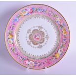 Sevres plate painted with flower on a pink border, the centre highly gilt with a central floral