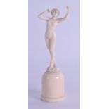 A SMALL ART NOUVEAU CARVED EUROPEAN IVORY FIGURE OF A NUDE FEMALE modelled upon a plinth. 8.75 cm