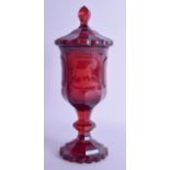 A 19TH CENTURY BOHEMIAN RUBY GLASS GOBLET VASE AND COVER engraved with roaming horses within