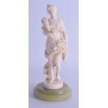 A GOOD 19TH CENTURY EUROPEAN CARVED IVORY FIGURE OF A FEMALE representing the four seasons, upon