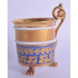 19th c. Superb Paris porcelain three footed cup in French Empire style decorated in blue and gold