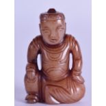 A SMALL CHINESE CARVED RUSSET JADE FIGURE OF A SEATED MALE modelled in robes. 5.75 cm high.