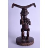AN EARLY 20TH CENTURY AFRICAN TRIBAL HARDWOOD FERTILITY STOOL modelled as two opposing females