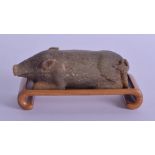 A RARE CHINESE WESTERN HAN DYNASTY CARVED JADE FIGURE OF A PIG 1st Century BC, modelled recumbent