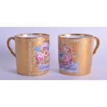 19th c. Paris porcelain beautifully painted and gilded pair of mugs each having flowers in a