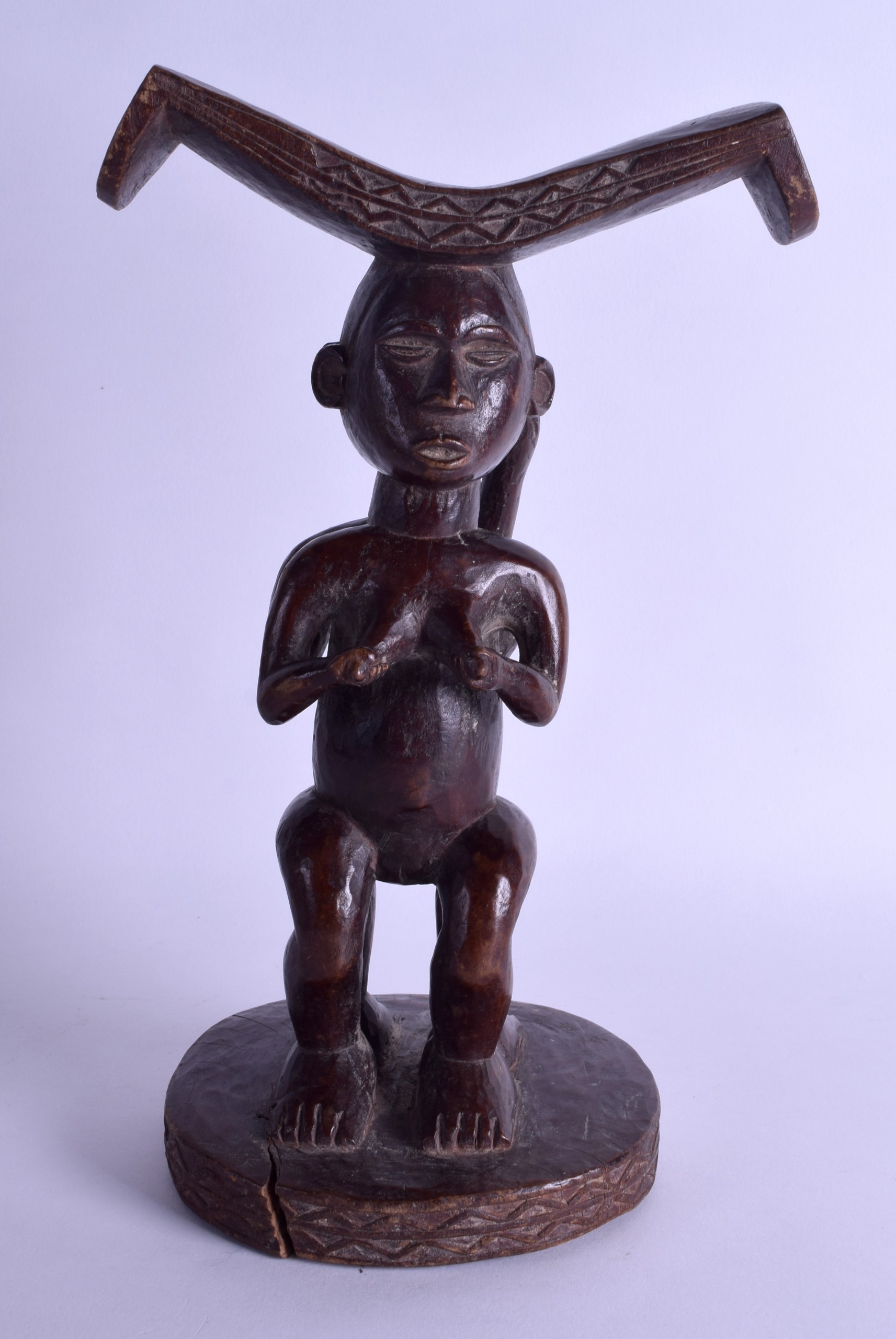 AN EARLY 20TH CENTURY AFRICAN TRIBAL HARDWOOD FERTILITY STOOL modelled as two opposing females - Image 2 of 2