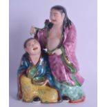 AN EARLY 20TH CENTURY CHINESE PORCELAIN FIGURE OF THE HEHE ERXIAN TWINS painted with floral