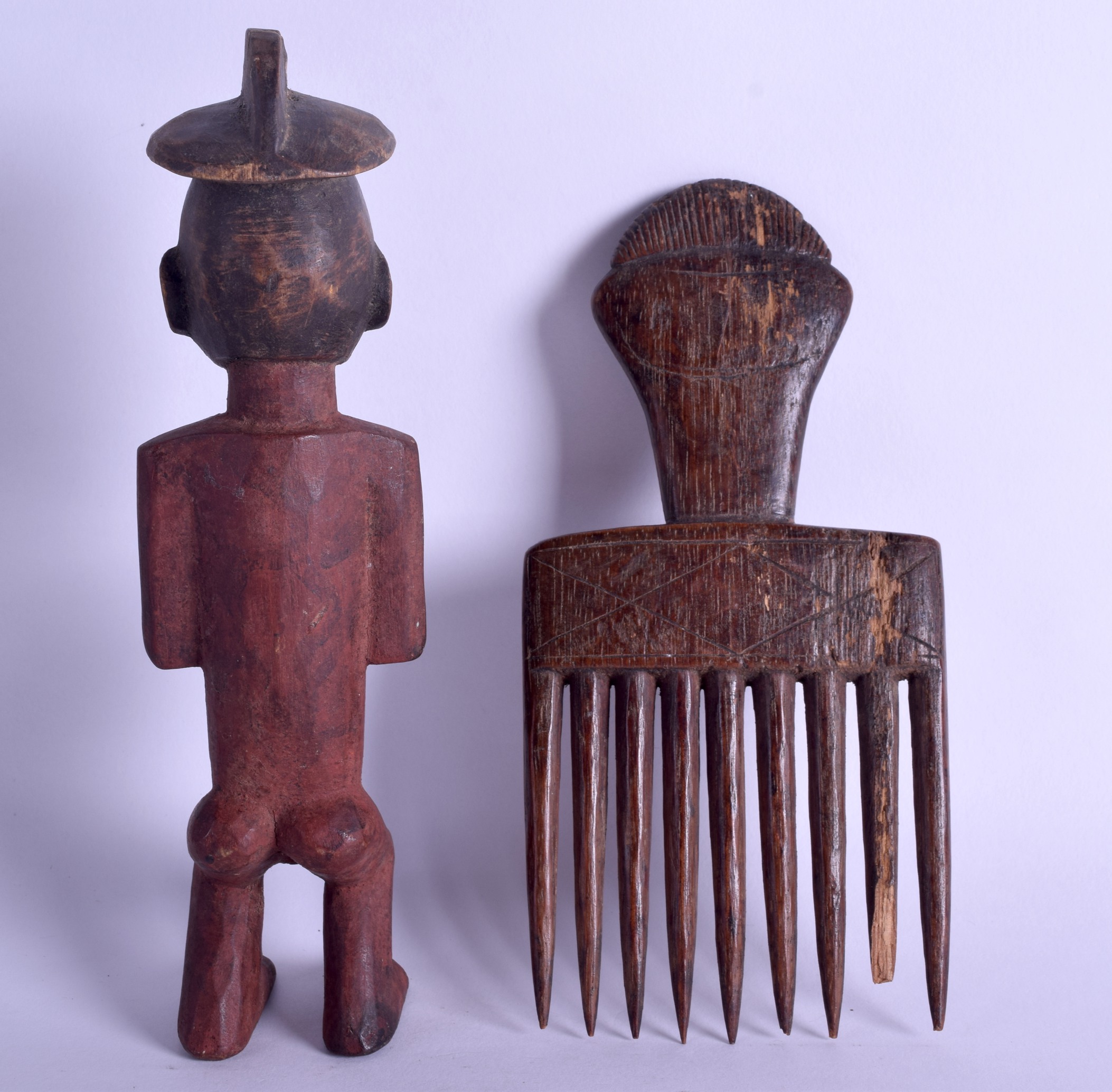 AN EARLY 20TH CENTURY AFRICAN CARVED TRIBAL FIGURAL COMB together with a polychromed wooden - Image 2 of 2