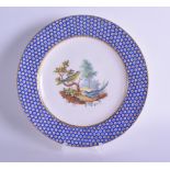 18th c. Sevres plate with blue and gilt dot border painted with a parakeet and American cuckoo,