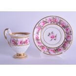 19th c. Paris cup and saucer the cup with footed with unglazed basal flutes, the scroll handle