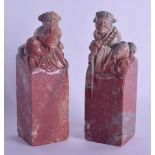 A LARGE PAIR OF MID 19TH CENTURY CHINESE CARVED HARDSTONE SEALS Qing. Modelled as figures upon