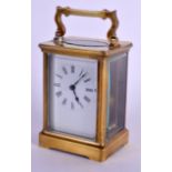 AN EARLY 20TH CENTURY FRENCH BRASS CARRIAGE CLOCK with black numerals and white enamel dial. 14.5 cm