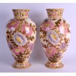 A LARGE PAIR OF ART NOUVEAU HUNGARIAN ZSOLNAY PECS VASES painted with floral sprays under a yellow