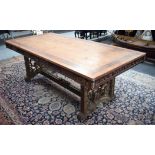 AN EARLY 20TH CENTURY CHINESE DINING TABLE, the top oak with burr walnut banding, carved lacquered