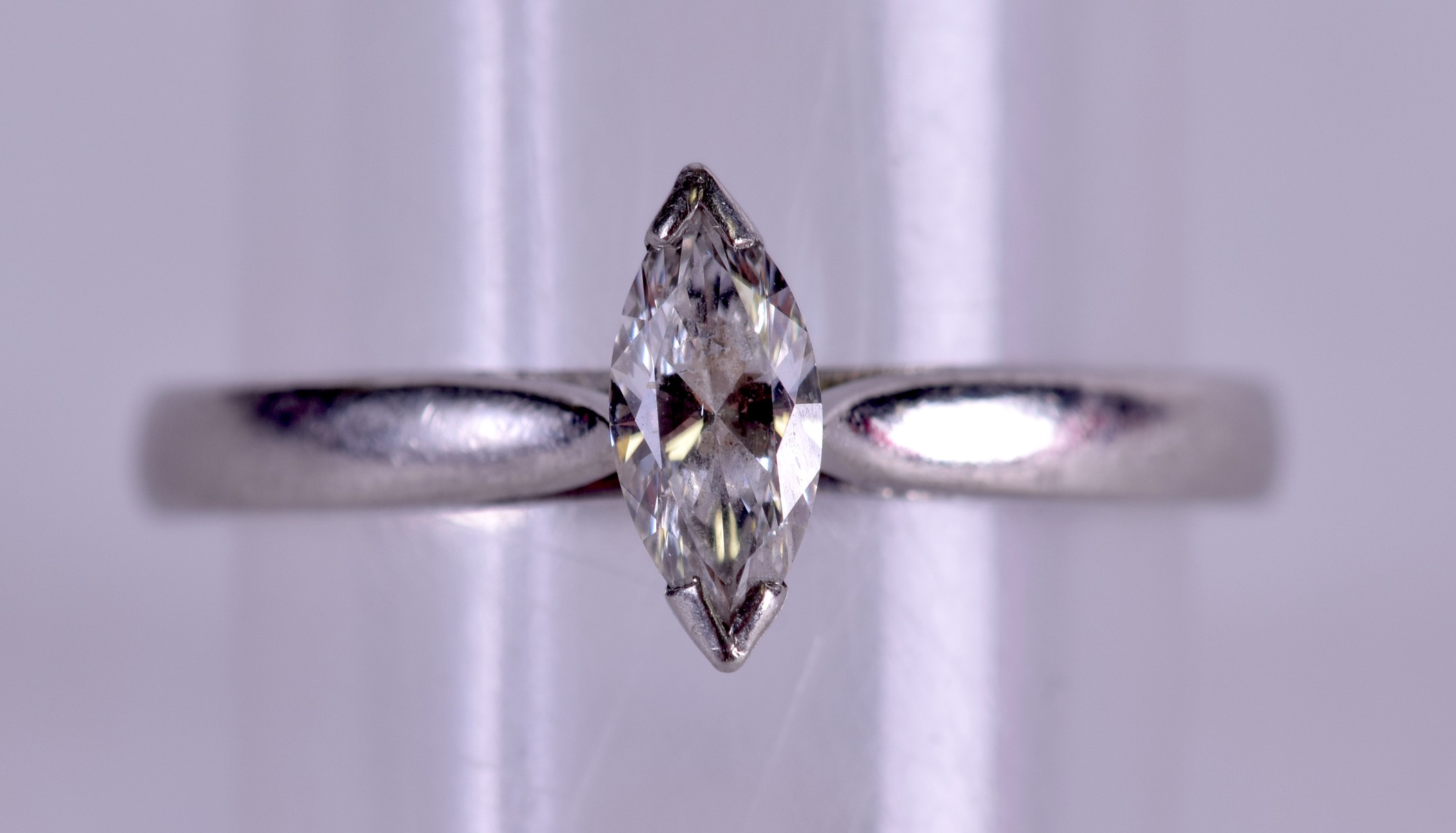 AN 18CT WHITE GOLD AND DIAMOND MARQUISE CUT RING. Size K.