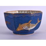 A WEDGWOOD LUSTRE OCTAGONAL PORCELAIN TEA BOWL painted with fish swimming amongst reeds. 10 cm