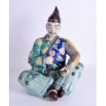 A LARGE MID 19TH CENTURY JAPANESE MEIJI PERIOD AO KUTANI FIGURE OF A SAMURAI modelled seated in