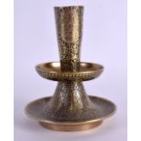 A 17TH/18TH CENTURY ISLAMIC MIDDLE EASTERN BRONZE CANDLESTICK engraved with unusual mythical figures