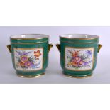 A PAIR OF EARLY 20TH CENTURY PARIS PORCELAIN SEVRES STYLE CACHE POTS painted with floral sprays upon