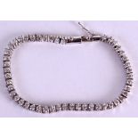 AN 18CT WHITE GOLD AND DIAMOND TENNIS BRACELET. 16 cm long.