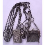 A 19TH CENTURY CONTINENTAL CHATELAINE formed with a note pad, scissors, a coin purse etc.