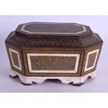 AN EARLY 19TH CENTURY ANGLO INDIAN CARVED IVORY MICRO MOSAIC OCTAGONAL CASKET with fine brass work