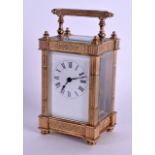 AN EARLY 20TH CENTURY FRENCH BRASS CARRIAGE CLOCK decorated with foliage and trailing vines. 15 cm