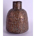 AN 18TH/19TH CENTURY MIDDLE EASTERN COPPER ISLAMIC VESSEL decorated with Kufic script and motifs. 18